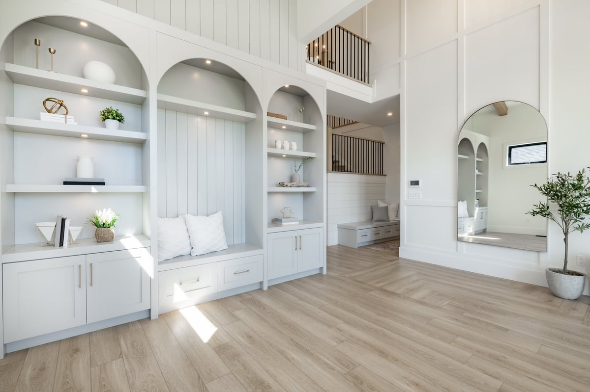 Beautiful restored hardwood flooring in a bright open-concept home